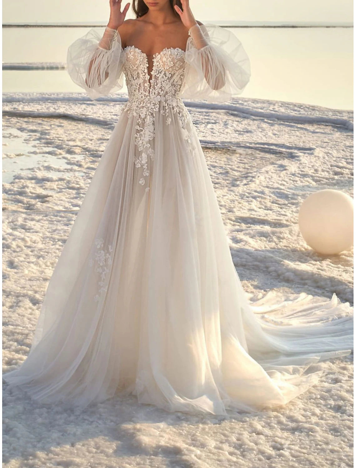 Ivory A-line off-shoulder long sleeve lace wedding dress with appliques and court train