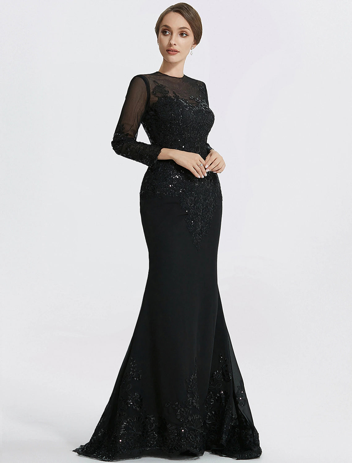 Black floor-length evening gown with long sleeves, jewel neck, and lace with appliques