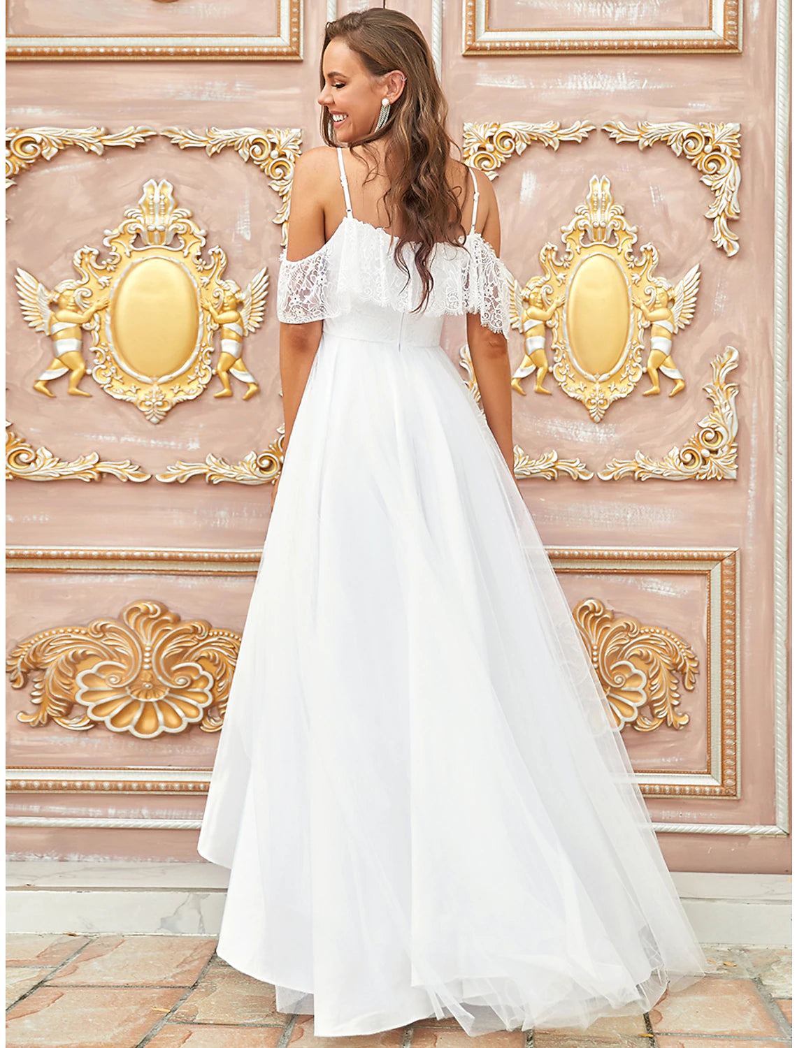 Detail of asymmetrical lace draping and short sleeves on A-line wedding dress