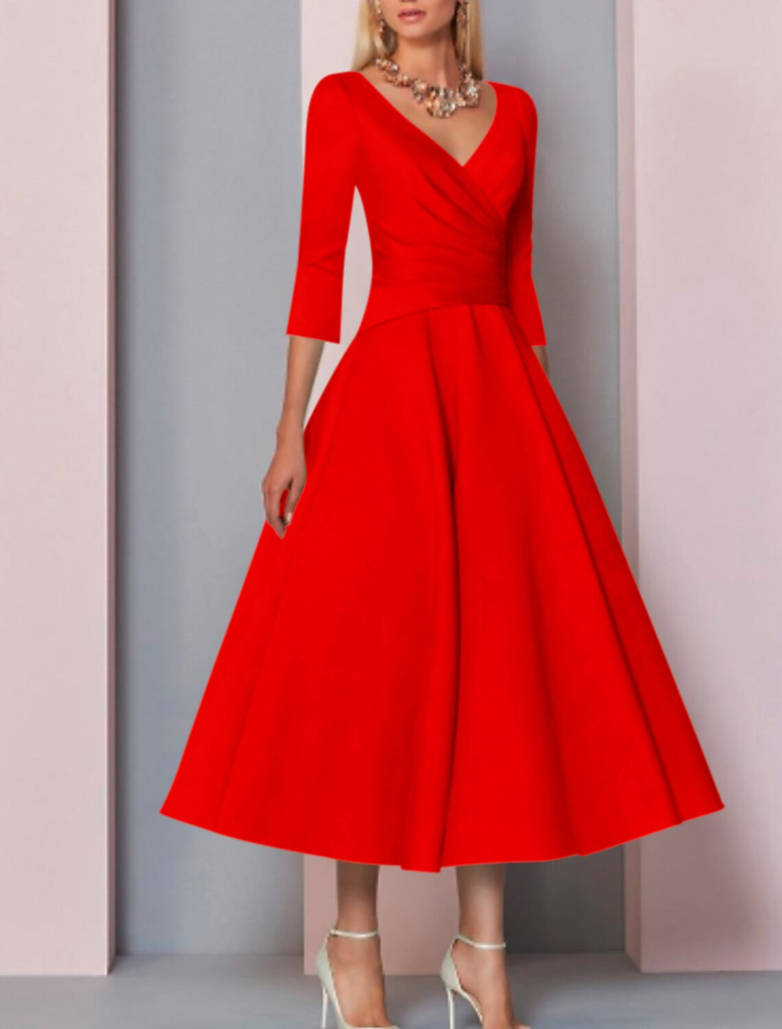 Pleated satin mother of the bride dress with V-neck and tea-length skirt