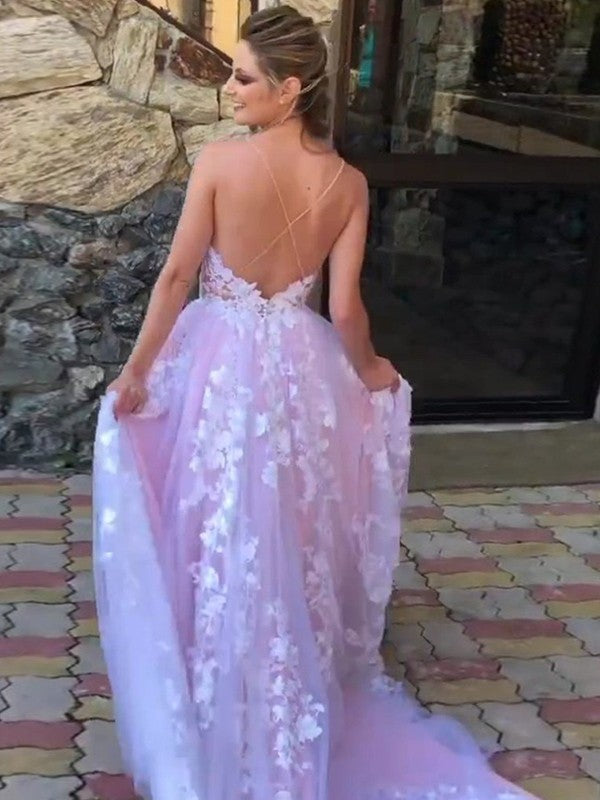 Ball gown prom dress featuring lace appliques, V-neckline, and sweep brush train