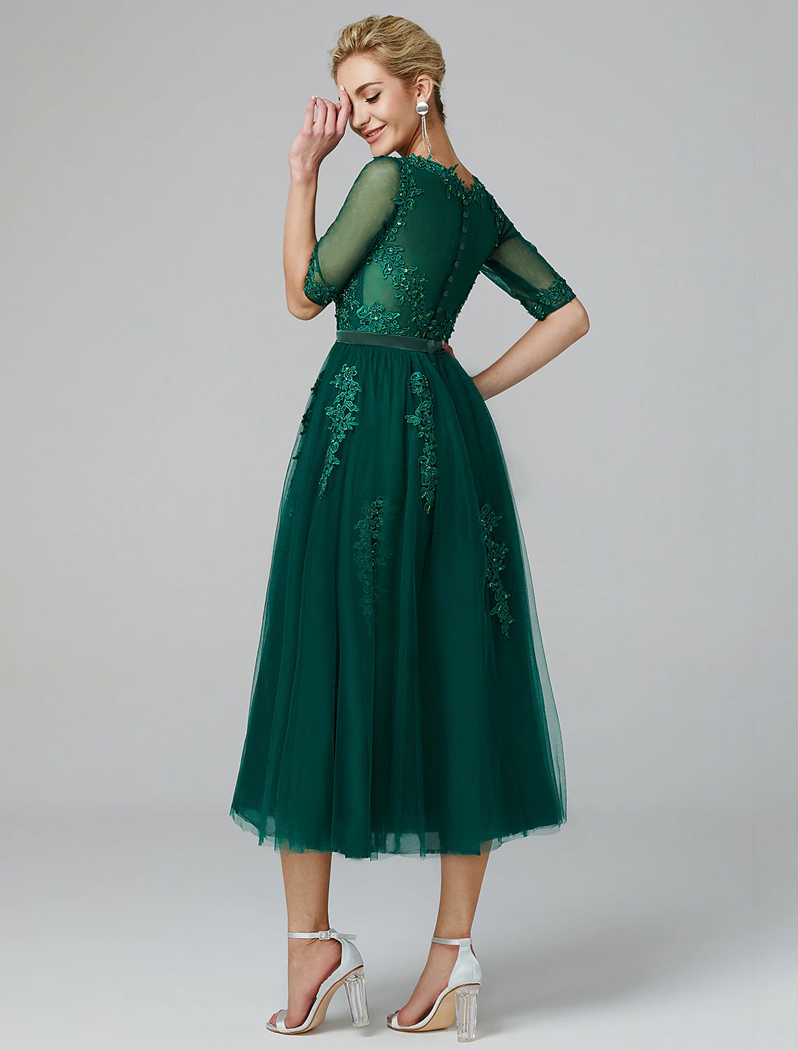 Sleeveless illusion neck tea length formal evening dress in lace over tulle with sequin appliques