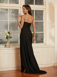 Black strapless jersey sheath prom dress featuring sweep train