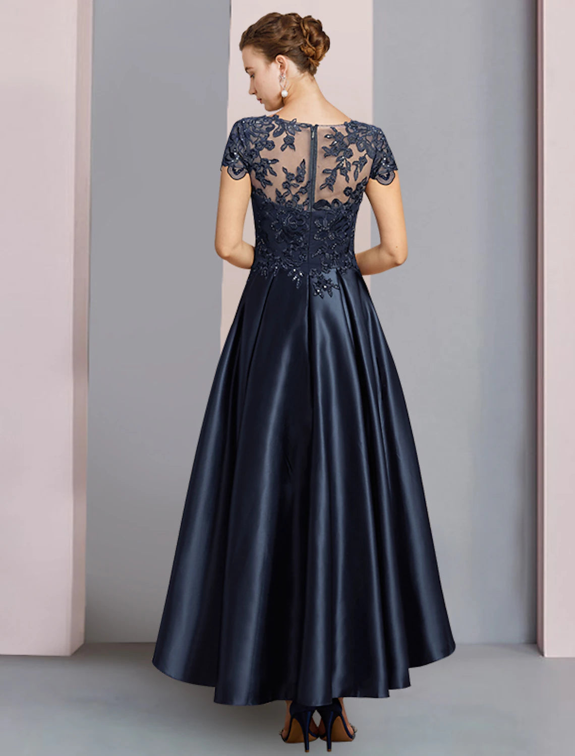 A-line high-low mother of the bride dress with lace and sequin embellishments in dark navy
