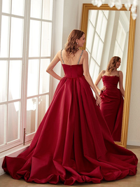 Sleeveless ruched satin sheath prom dress with spaghetti straps and chapel train