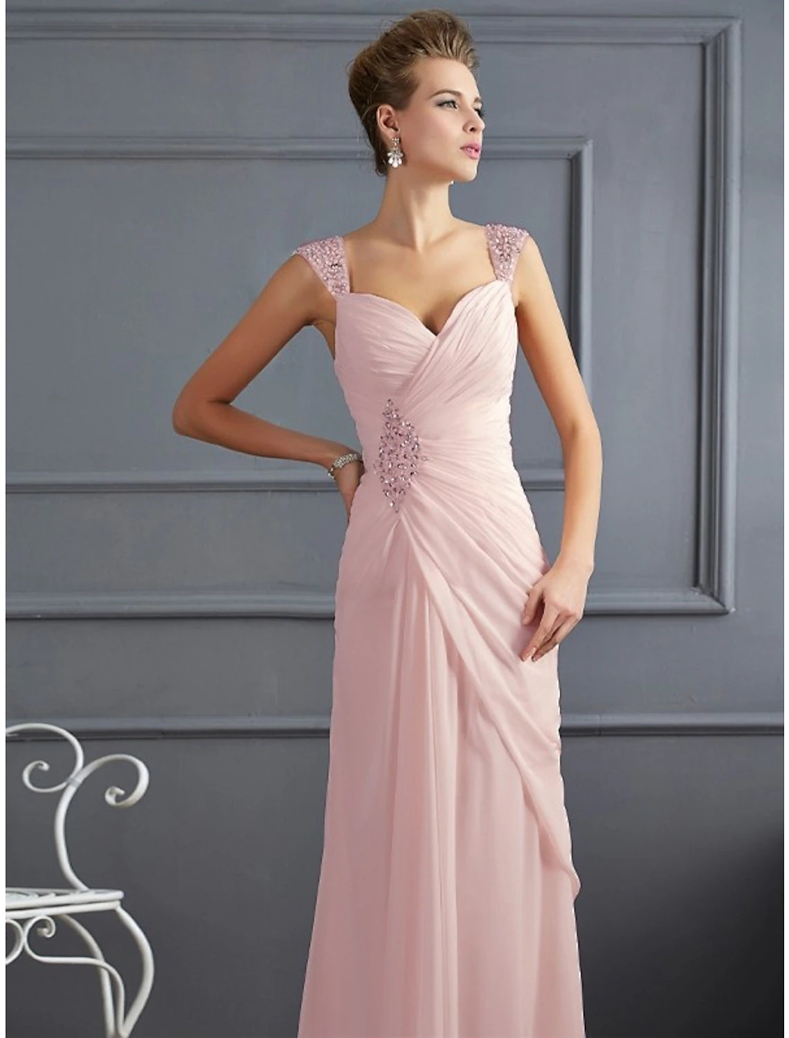 Floor-length sleeveless mermaid evening gown in pink chiffon with rhinestone ruched accents