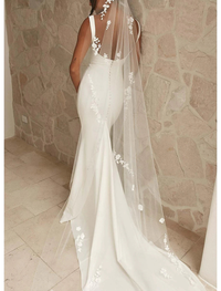 White camisole satin bridal gown featuring delicate beading and court train