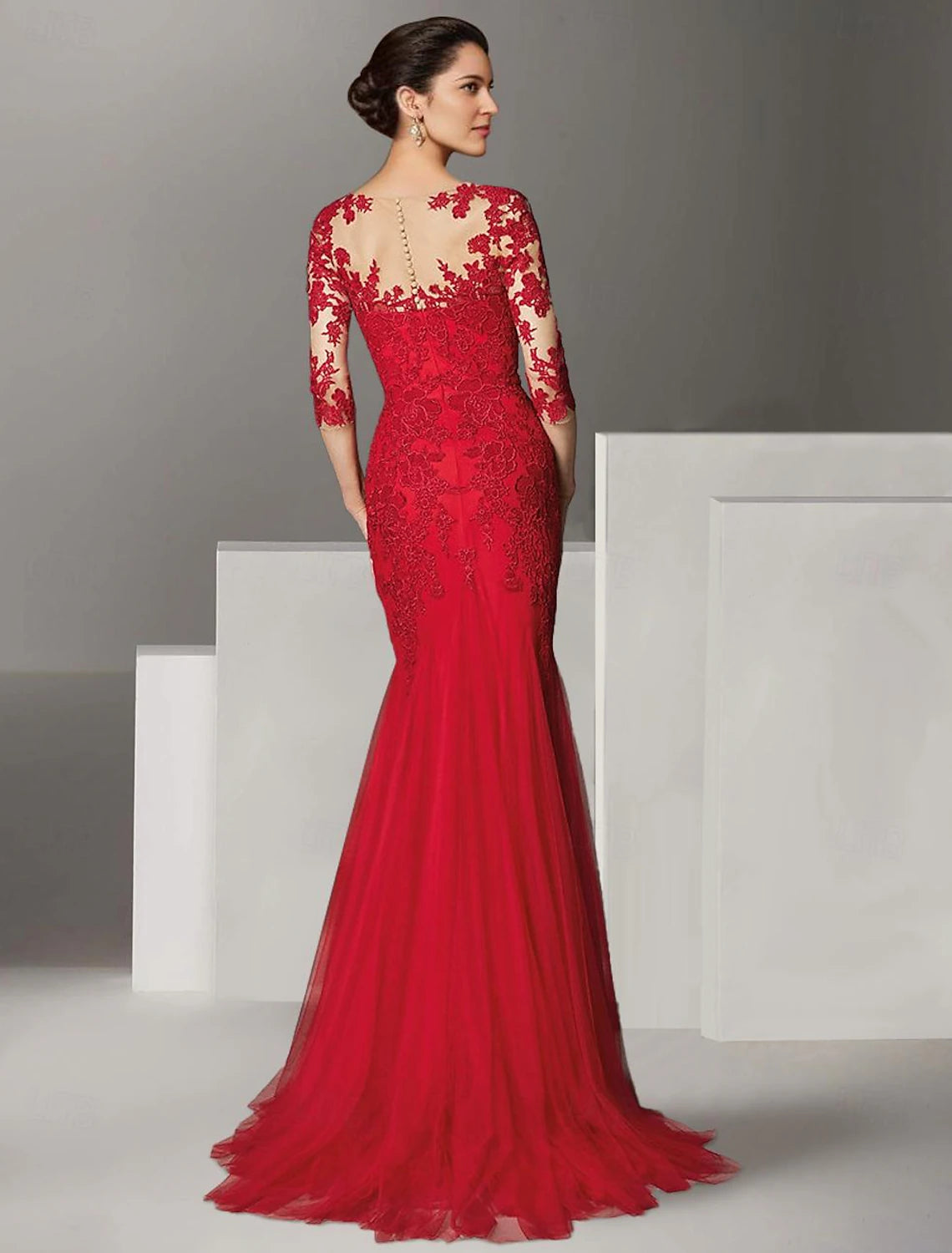 Lace and tulle mermaid mother of the bride dress featuring pleats, beading, and a court train