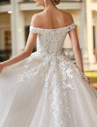 Ivory two-piece wedding dress with satin skirt, court train, and off-the-shoulder beading appliques