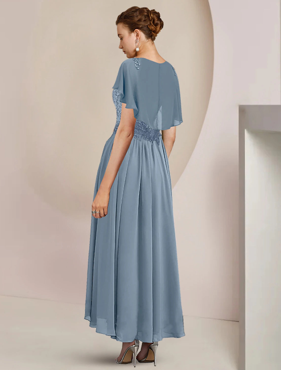 A-line mother of the bride dress in chiffon and lace with tea length hemline and beading appliques