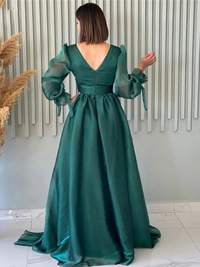 Sweep train and skirt detail on A-line organza prom dress with long sleeves