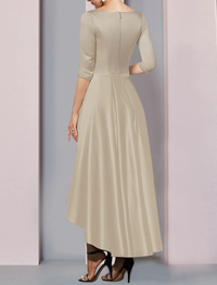 Side view of Champagne satin dress showing side-draped pleats and ankle-length asymmetrical hemline