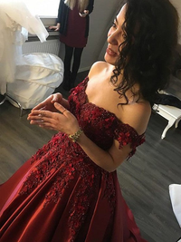 Back view of sleeveless off-the-shoulder satin ball gown prom dress