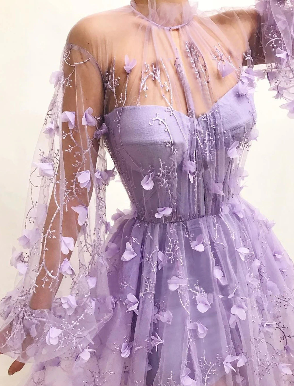Floor-length A-line prom dress with long sleeves, V-neckline, and floral tulle appliques