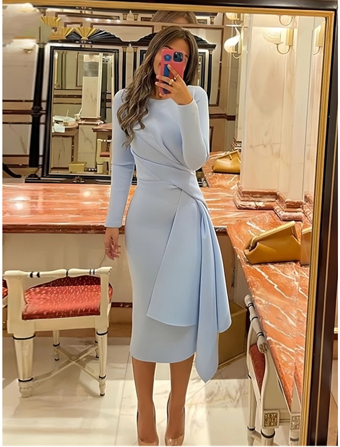 Sheath cocktail dress featuring ruched pleats and long sleeves in stretch fabric