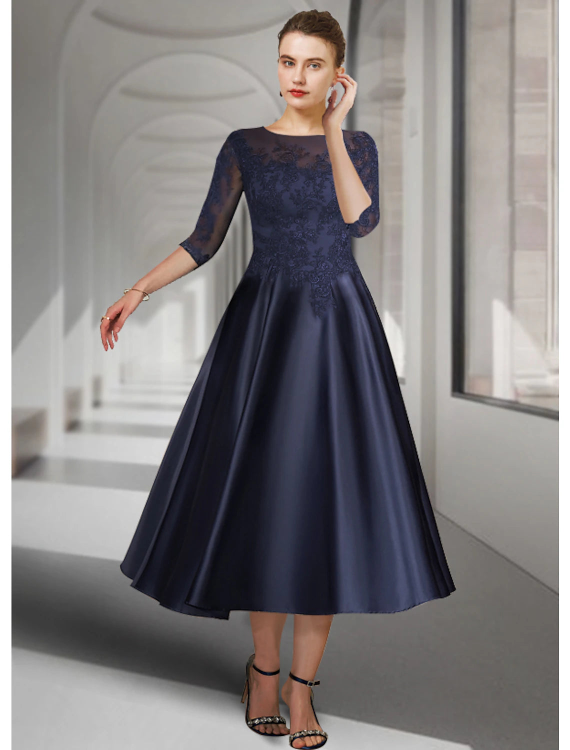 A-line tea-length mother of the bride dress with jewel neckline, 3/4 sleeves, and lace appliques