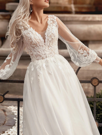 Lace applique detailing on Ivory A-line V-neck wedding dress