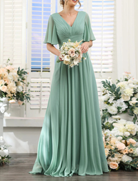 Side angle of floor-length A-line bridesmaid dress featuring short sleeves and front split