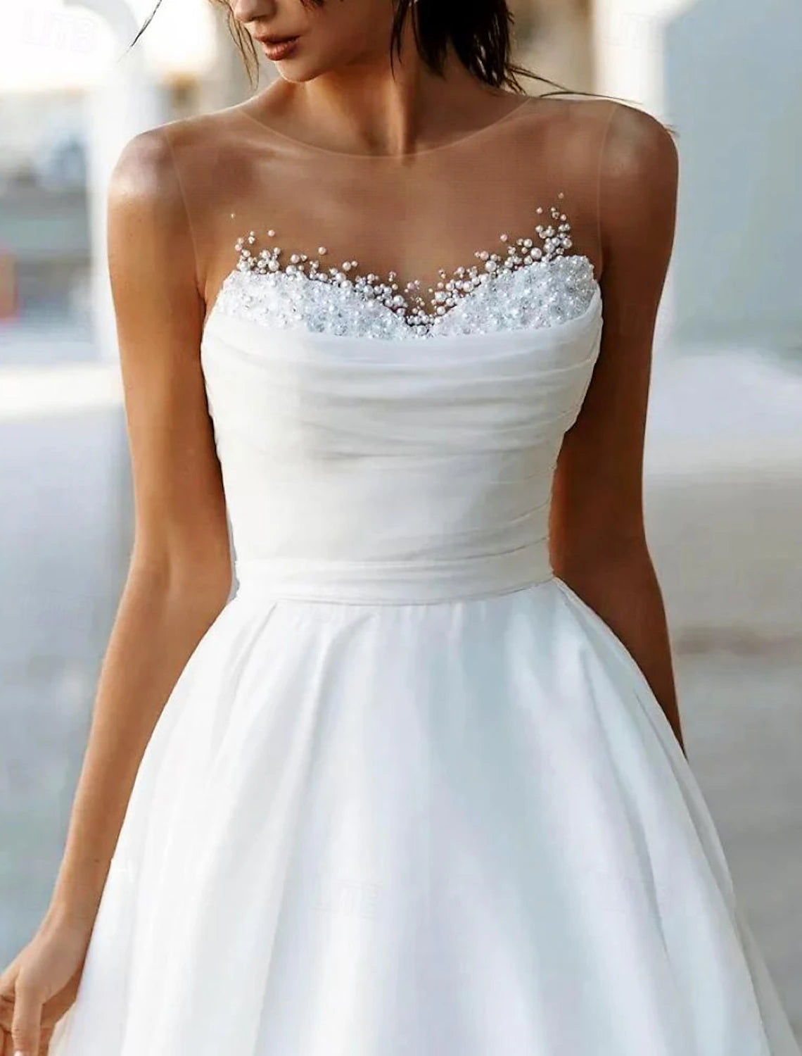 White sleeveless A-line wedding dress in tulle with boat neckline