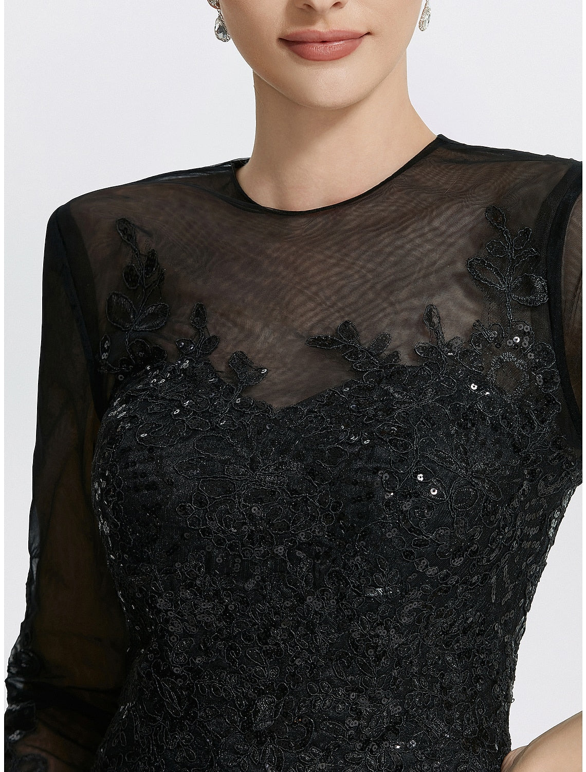 Floor-length black formal dress with jewel neck and long sleeve design