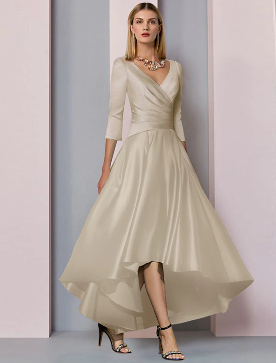 Detailed view of the pleated side drape and satin finish on mother of the bride gown