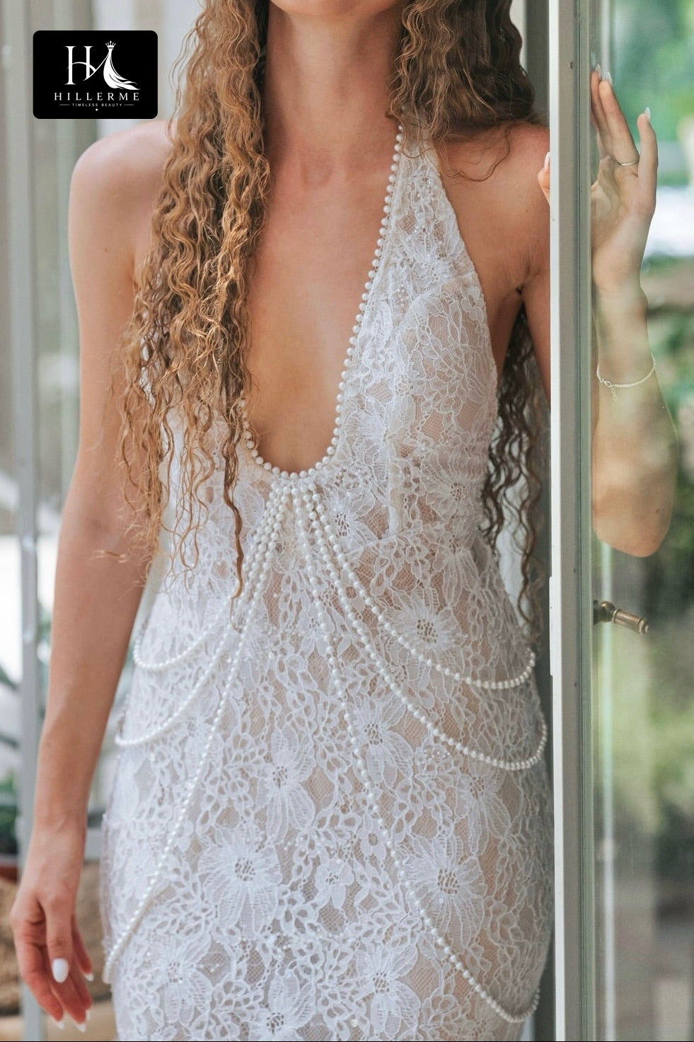 Sleeveless Halter Bridal Gown with Deep V Neckline and Pearl Accent