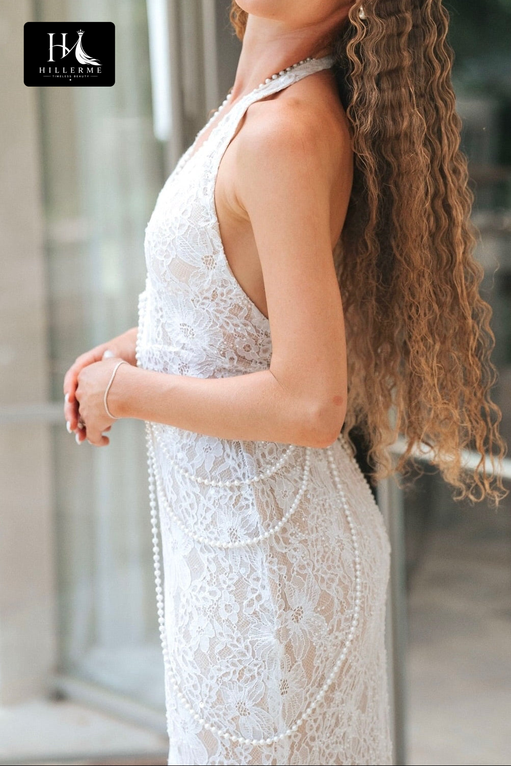 Sleeveless Halter Bridal Gown with Deep V Neckline and Pearl Accent
