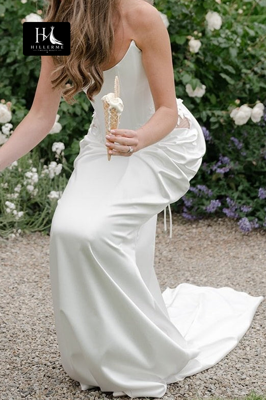 Elegant Strapless Corset Bridal Gown with Asymmetrical Ruched Skirt and Sweep Train